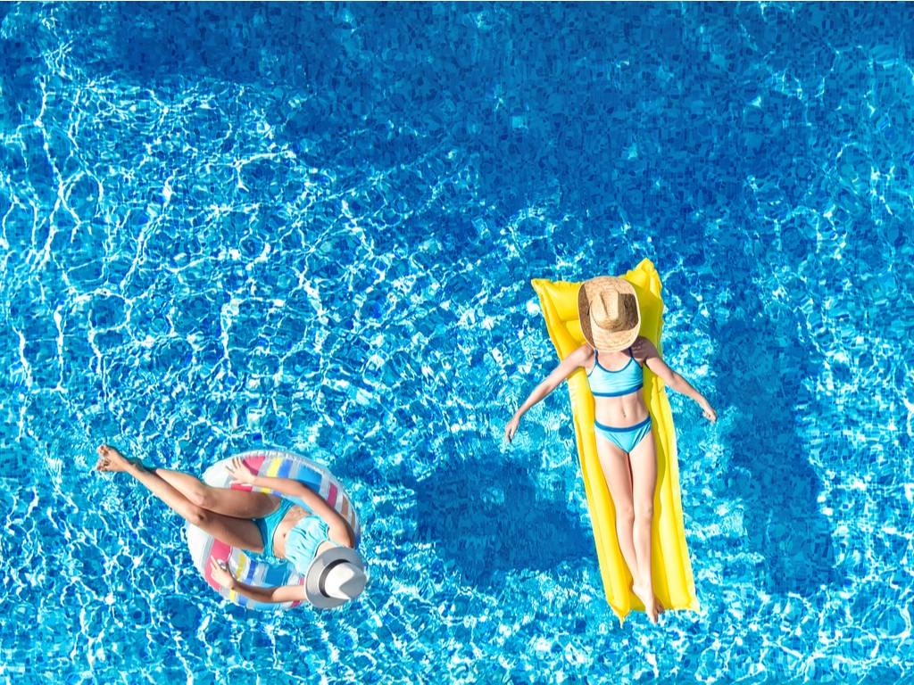 women floating in an Above-Ground Pool