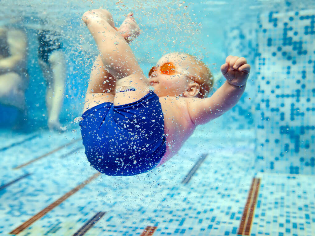 infant in swimming pool