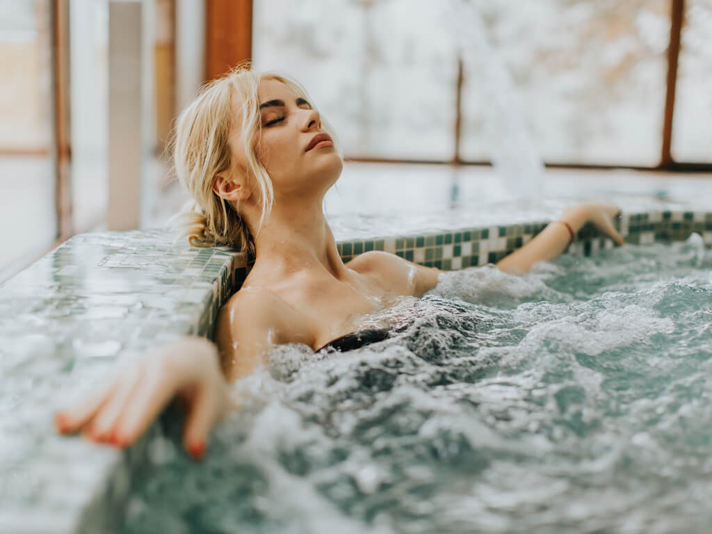 woman relaxing in hot tub