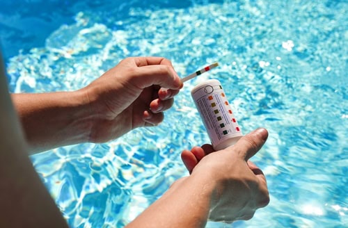 checking-water-quality-pool